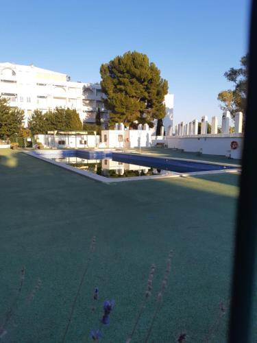 a view from a window of a tennis court at Marino114 in Alcossebre