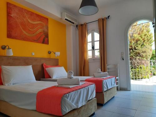 A bed or beds in a room at Athina Apartments