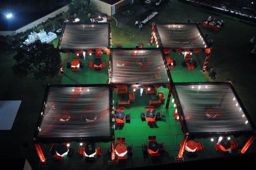 an overhead view of a cafeteria with tables and chairs at night at Best Western Maryland in Chandīgarh
