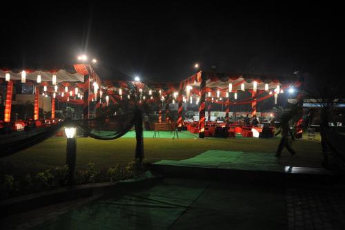 a group of tents with lights at night at Best Western Maryland in Chandīgarh