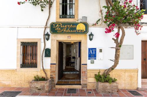 a building with a sign for a restaurant at Puerta De Aduares in Marbella