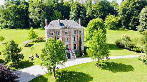 an aerial view of a large house with trees at Domaine de la Cressonnière 