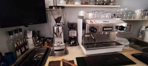 a kitchen counter with a blender on top of it at Godot Apartman in Miskolc