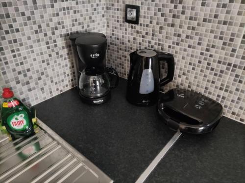 a coffee maker on a counter in a kitchen at Music Reflections Apartment near Nafplio in Néa Kíos