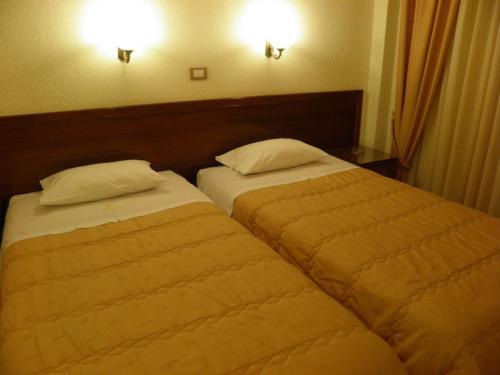 Posteľ alebo postele v izbe v ubytovaní Hotel Meletiou