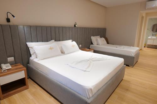 Posteľ alebo postele v izbe v ubytovaní Armar Hotel