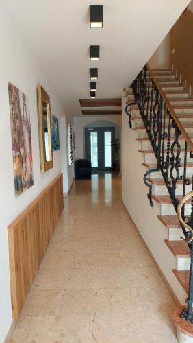 a hallway of a house with a staircase at Hotel Seerose Wolfgangsee in St. Wolfgang