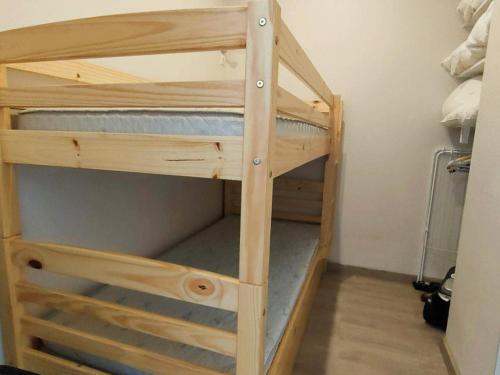 a couple of bunk beds in a room at Appartement Cauterets, 3 pièces, 6 personnes - FR-1-234-172 in Cauterets