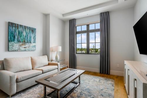 a living room with a couch and a coffee table at The Heart of Naples in Naples