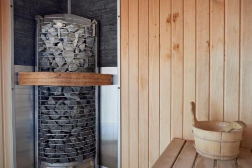 a corner of a room with a wall with a wine rack at Vintage breeze Apartment - Spa Pools resort in Mamaia