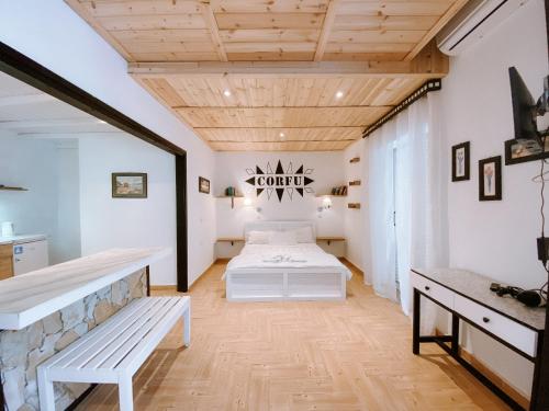 A bed or beds in a room at Villa Tasos