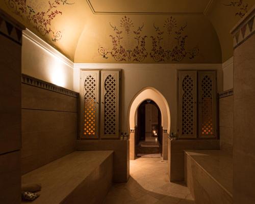 a hallway of a building with an archway at Le Riad Villa Blanche in Agadir