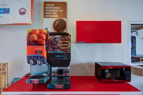 a coffee maker on a counter next to a microwave at Motel 6 Saint George, UT in St. George