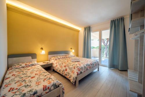 Residence Le Grazie Estにあるベッド