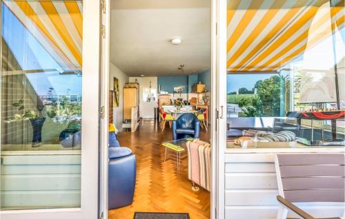 a room with a view of a kitchen and a living room at Cozy Home In Bruinisse With Wifi in Bruinisse