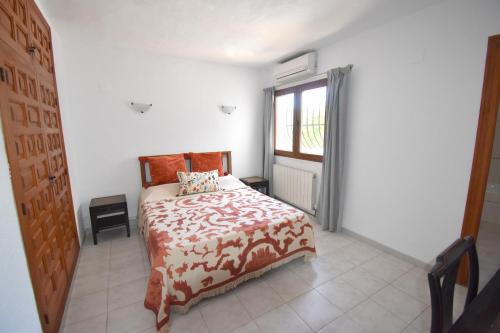 A bed or beds in a room at Casa Liberty Javea
