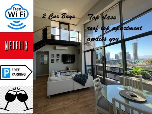 a collage of two pictures of a living room and a apartment at STUNNING! 'New York Style' Roof Top 2 Car Apartment in Perth