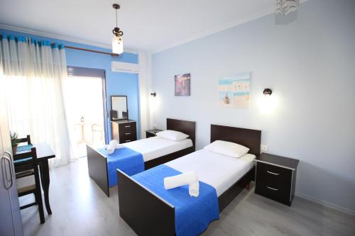 Ένα ή περισσότερα κρεβάτια σε δωμάτιο στο Keos Hotel