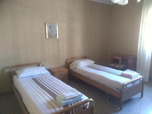 Een bed of bedden in een kamer bij Bisceglie Vacanze