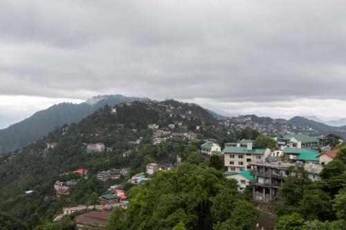 a view of a town on a mountain at The Oasis Mussoorie - A Member of Radisson Individuals in Mussoorie