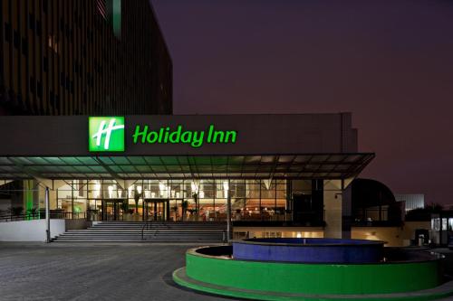 a hudley firm building with a sign on it at Holiday Inn Sao Paulo Parque Anhembi by IHG in Sao Paulo