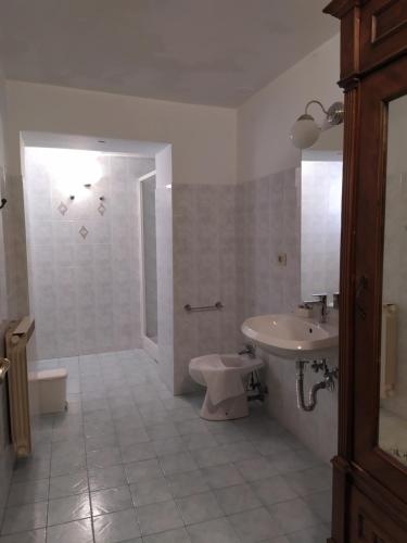 a bathroom with a sink and a toilet and a shower at B&B Home in Florence in Florence