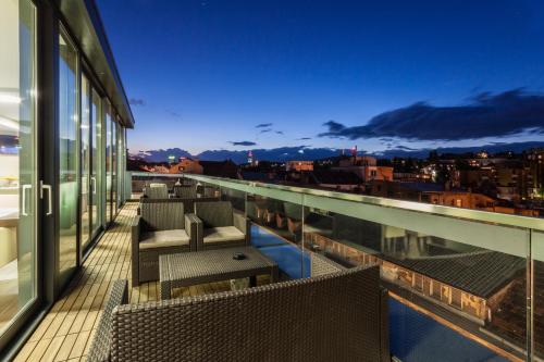 En balkon eller terrasse på City Boutique Hotel