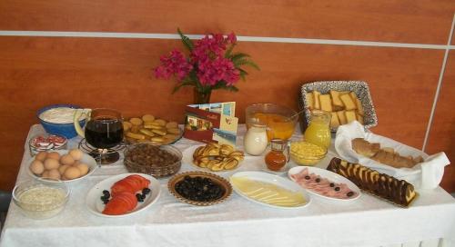 a table with food and other foods on it at Hotel Galaxy in Loutra Edipsou