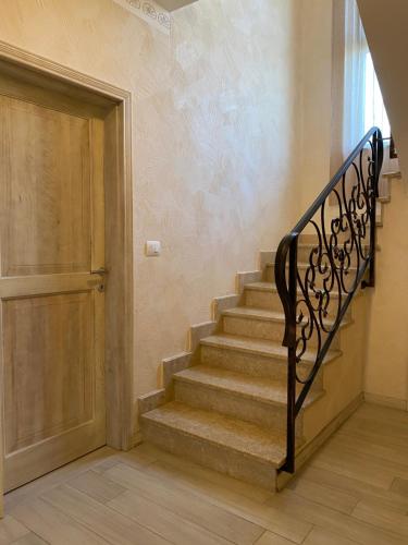 a staircase leading to a door in a house at Villa Eva Karigador in Novigrad Istria
