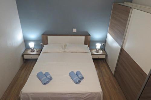 Postel nebo postele na pokoji v ubytování Apartmani Lucia