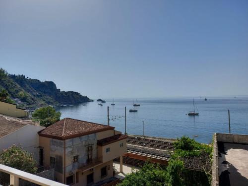 a view of a body of water with boats in it at Case Pagano Mare in Taormina