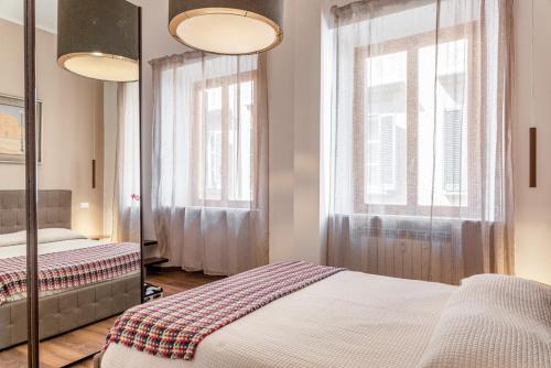 A bed or beds in a room at Piccola Venezia Canal View Charming Flat
