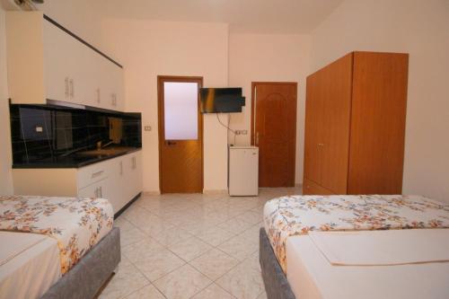 Ένα ή περισσότερα κρεβάτια σε δωμάτιο στο Hotel Vila Vilson