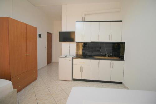 Η κουζίνα ή μικρή κουζίνα στο Hotel Vila Vilson