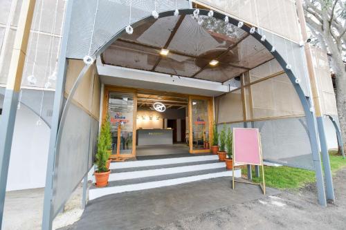 an entrance to a building with an archway at Shine Residency in Mysore