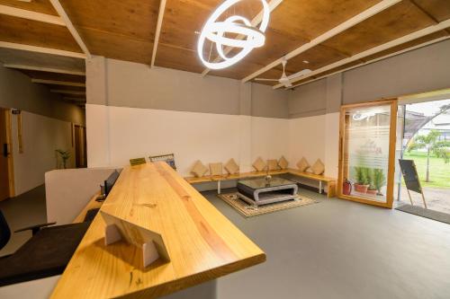 a conference room with a wooden table in the middle at Shine Residency in Mysore