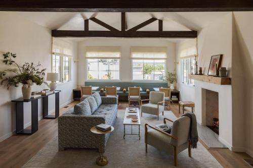 a living room with a couch and a fireplace at Villa Mara Carmel in Carmel
