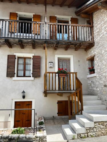 a building with stairs and balconies on it at Albergo Diffuso Faller in Faller