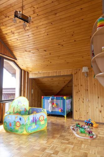 a childs room with a play room with a pool at Guesthouse Gaby in Sapareva Banya