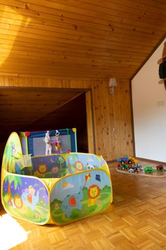 a childs play equipment in a room with a play set at Guesthouse Gaby in Sapareva Banya