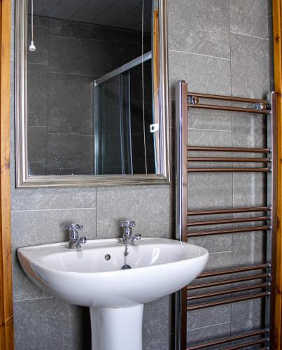 a bathroom with a white sink and a mirror at 33 Turner street in Redcar
