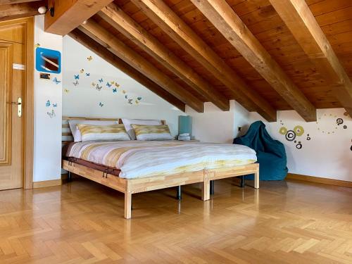 a bedroom with a bed in a room with wooden ceilings at Cà Borghetto in Venas