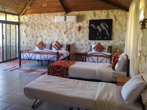 Postel nebo postele na pokoji v ubytování Infinity Lodge