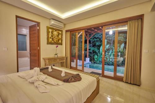 Postel nebo postele na pokoji v ubytování Jungle Haven Resort Central Ubud