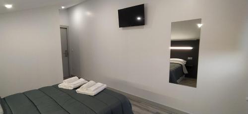 Ένα ή περισσότερα κρεβάτια σε δωμάτιο στο HOTEL Alojamientos Aviche 6