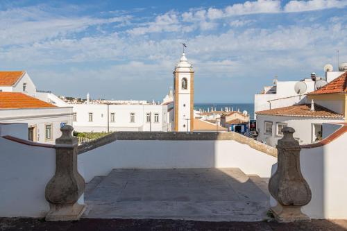 a view from the roof of a building with a clock tower at Downtown & Beach in Albufeira
