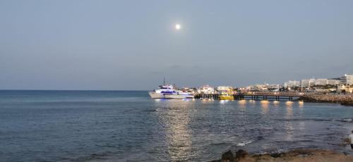 a boat is docked at a dock in the water at KSQUARED in Protaras