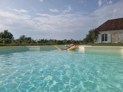 a person sitting on a kayak in the water at Clair de Vigne in Monbazillac