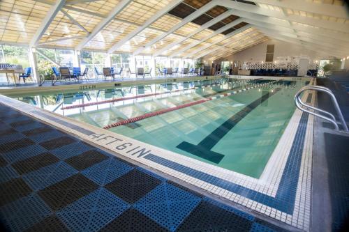 a large swimming pool in a building at The Villages at Ocean Edge Resort & Golf Club in Brewster