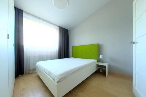Posteľ alebo postele v izbe v ubytovaní Smart Central Apartments